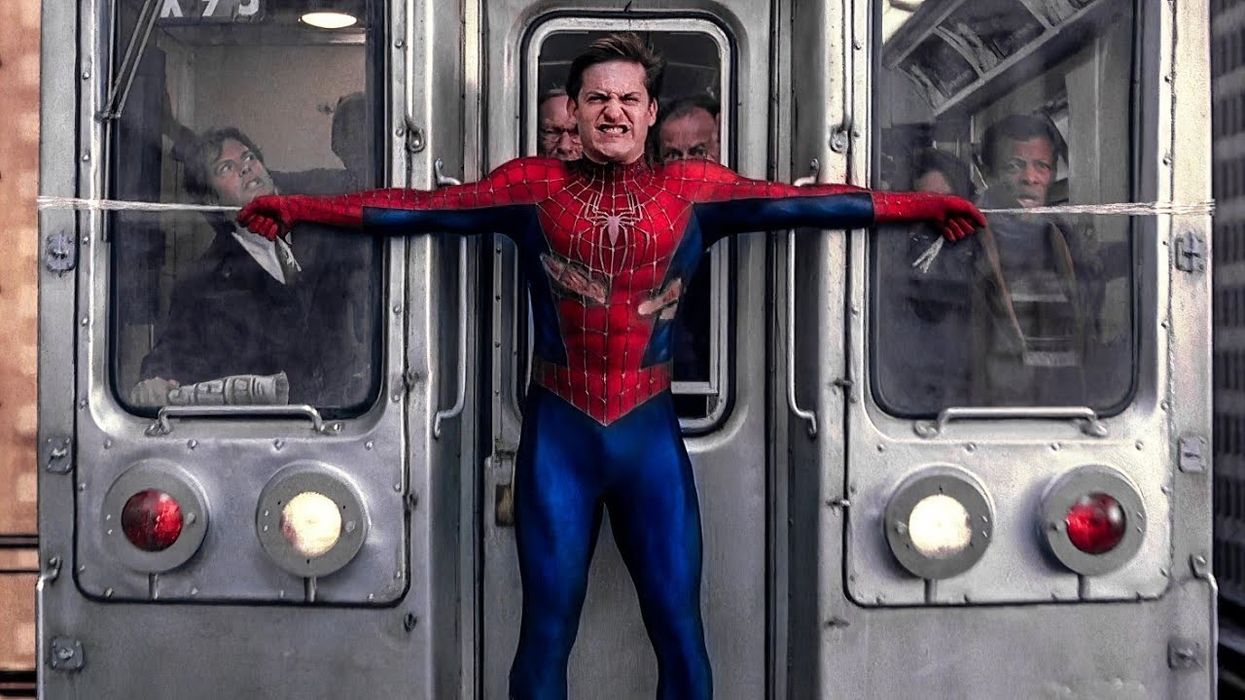 A bloody Spider-Man, played by Tobey Maguire, stopping a subway train with his webs in 'Spider-Man 2'