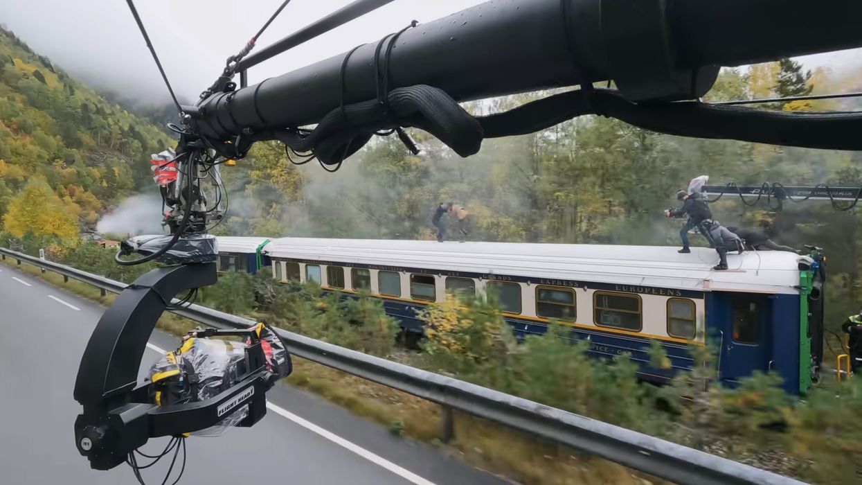 A camera filming two men fighting on a train, 'Mission: Impossible -- Dead Reckoning Part One'
