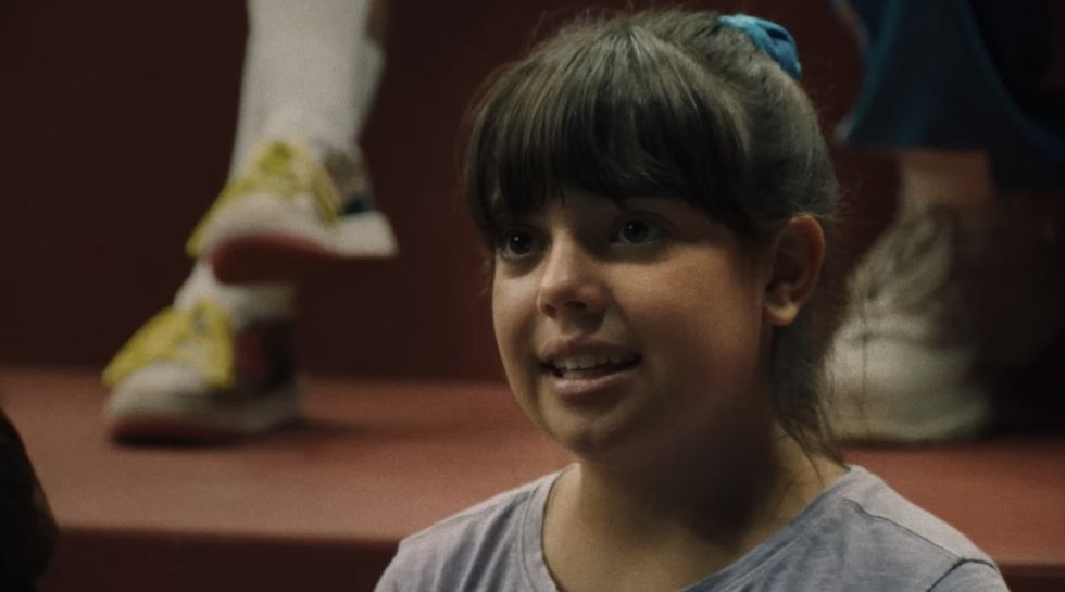 A child acting on a stage, 'Theater Camp'