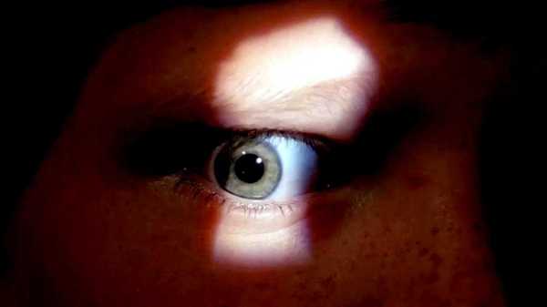A child's eye looking through a keyhole in Silent Night Deadly Night 1984
