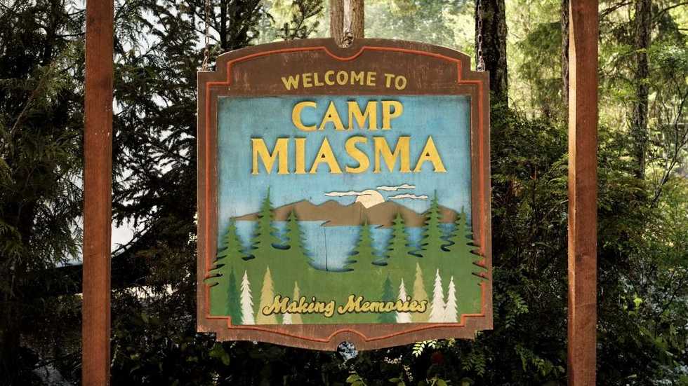 A close-up of the camp sign in Teenage Sex and Death at Camp Miasma