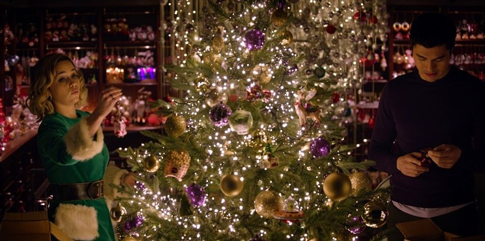 A couple decorating a Christmas tree in 'Last Chirstmas'