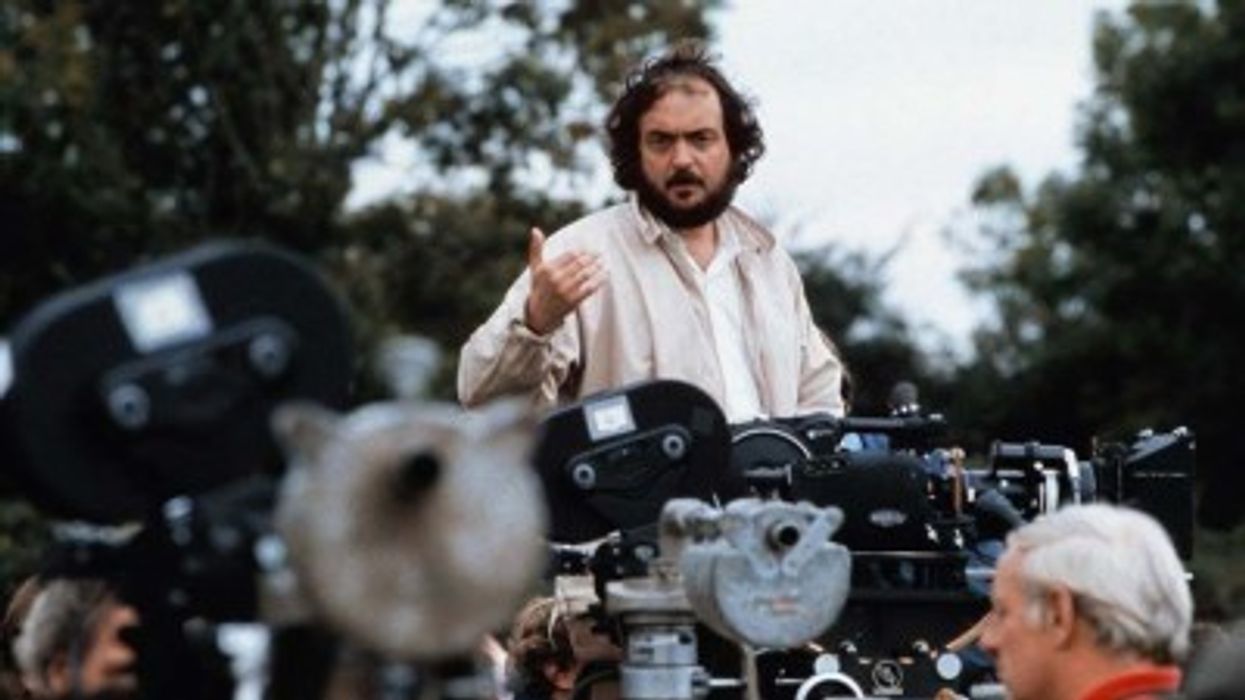 A director talking to his crew at the film cameras