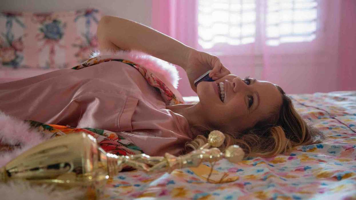 A girl in her room talking on the phone, 'Blood, Sweat and Cheer'