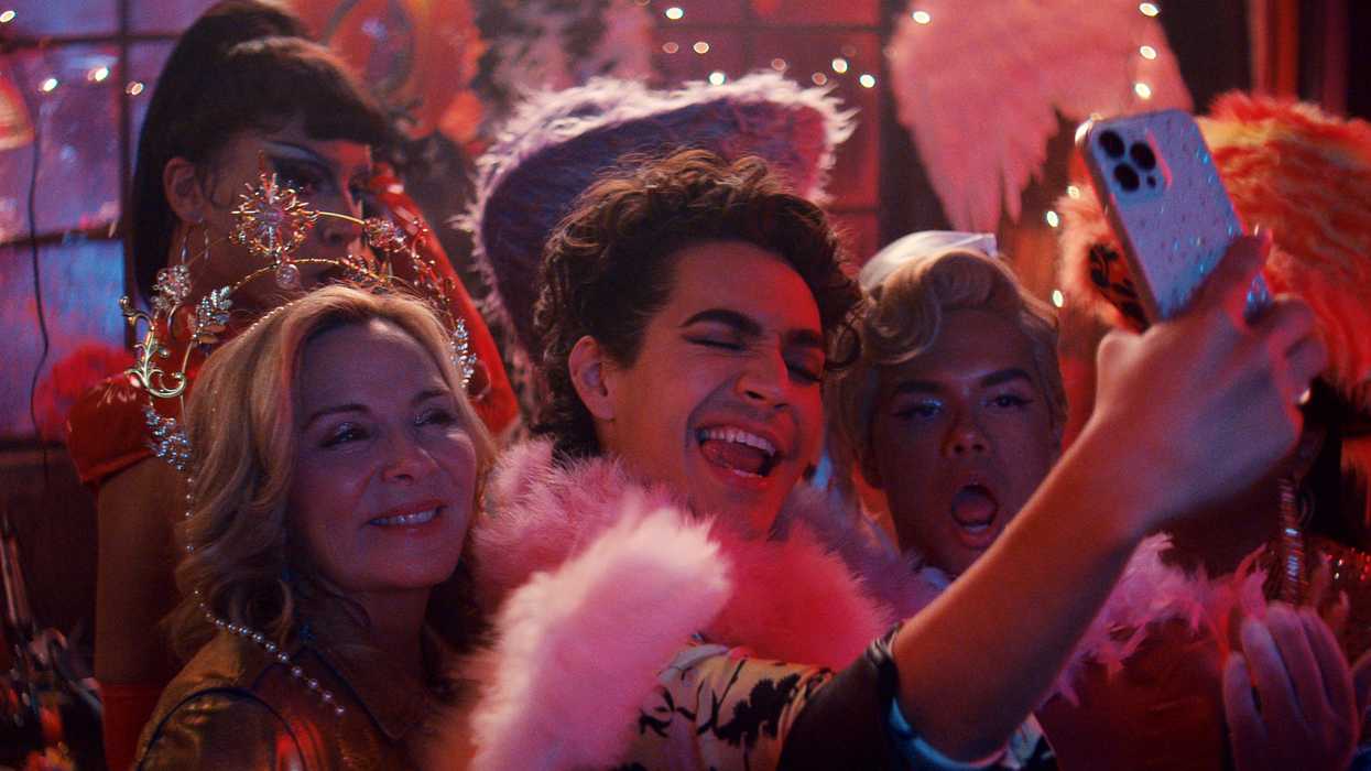 A group taking a selfie at a club, 'Glamorous'