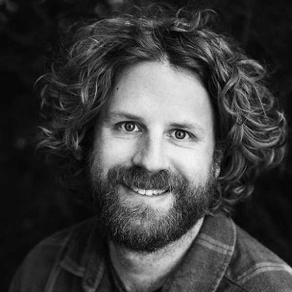 A headshot of producer and editor Jason Reid