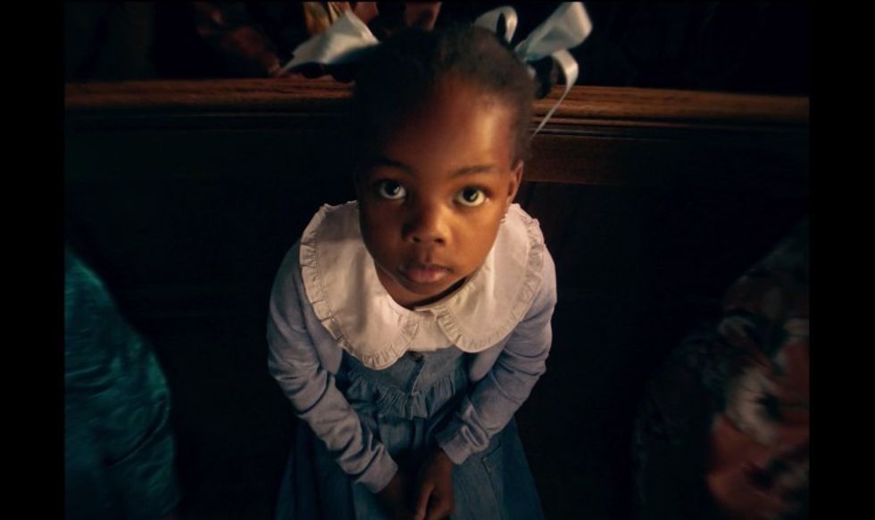 A little girl looking up in a church, 'Monochromatic'
