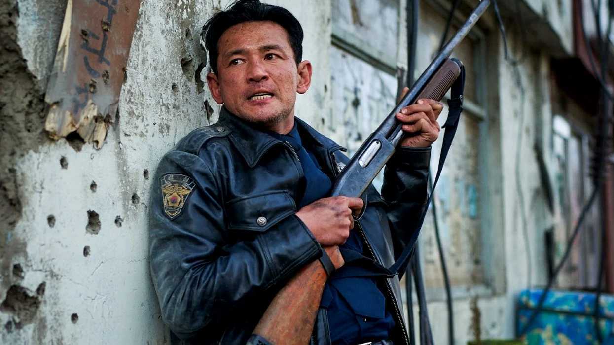 A man leaning against a wall while holding a gun in Hope 2026