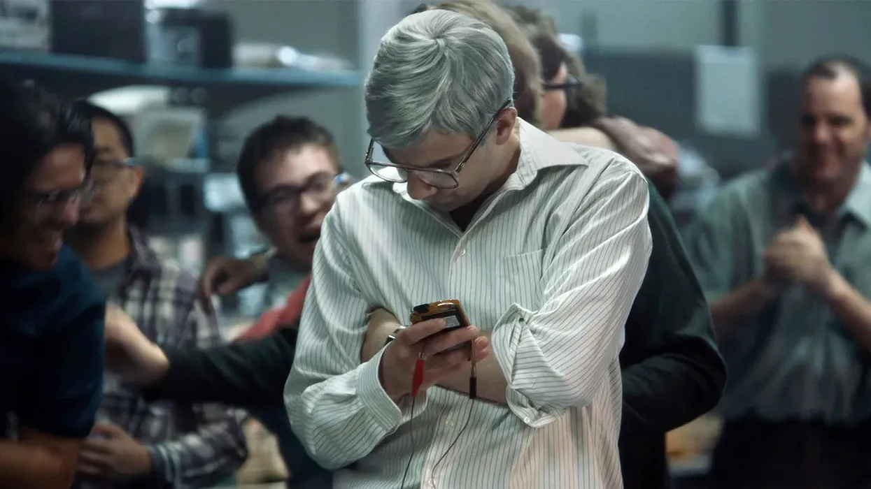 A man typing on a BlackBerry in 'BlackBerry'