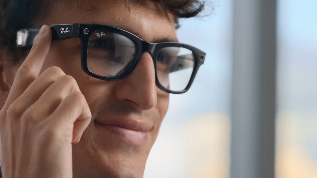 A man wearing black Ray-Ban smart glasses