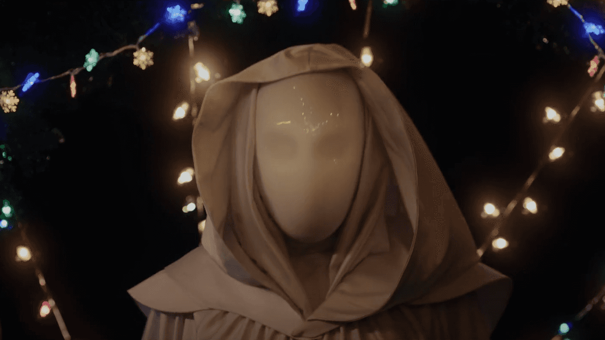A masked killers in a Christmas tree farm in 'It's a Wonderful Knife'
