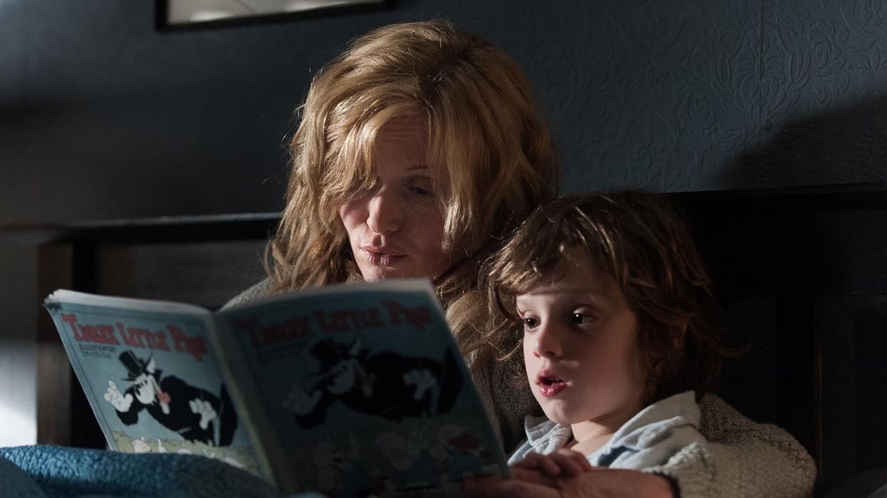 A mother and kid reading a book in 'The Babadook'