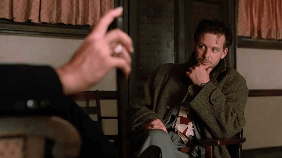A scene from the 1987 neo-noir horror film Angel Heart, featuring Mickey Rourke as private investigator Harry Angel