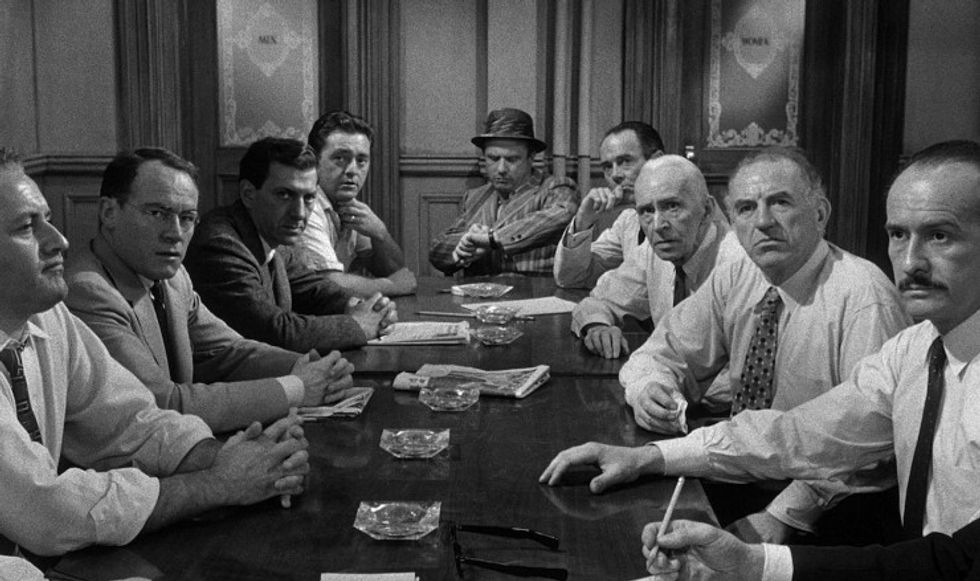 A table of men in '12 Angry Men'