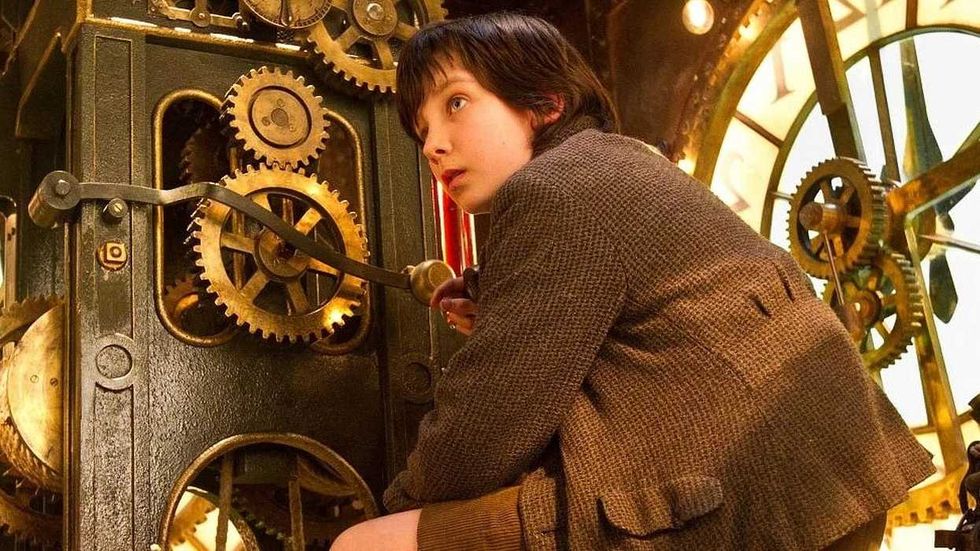 A\u0219a Butterfield messing with gears inside a clock in Hugo