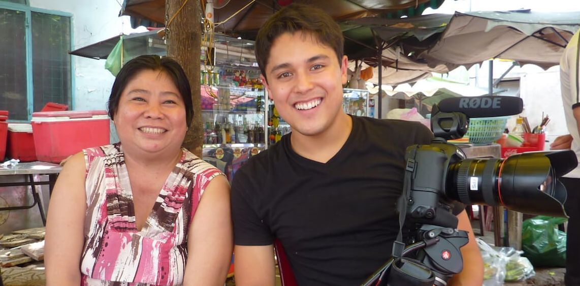 A woman sitting next to a man hold camera, 'Taste'
