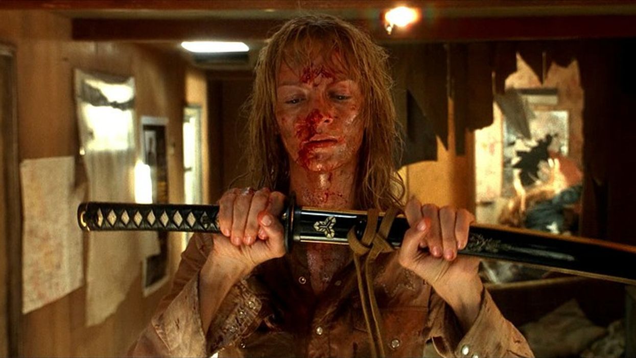 A woman with a bloody face holding a sword, 'Kill Bill: Vol 2'
