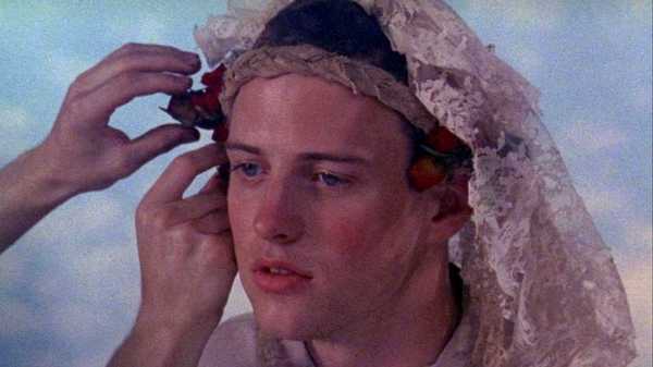 A young man having his veil adjusted in Poison