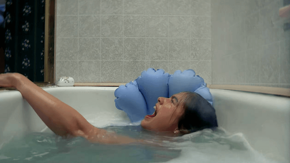Actress Heather Langenkamp as Nancy Thompson in a bathtub scene from the 1984 horror film A Nightmare on Elm Street