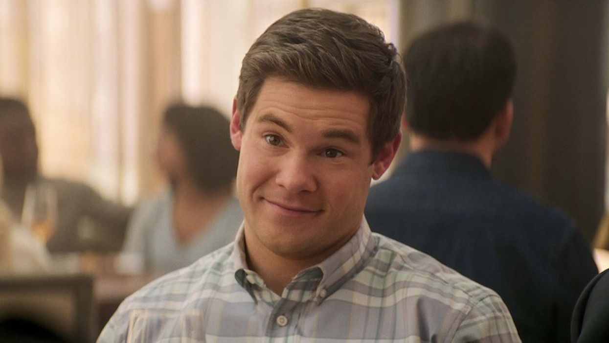 Adam DeVine as Owen Browning at dinner in 'The Out-Laws'