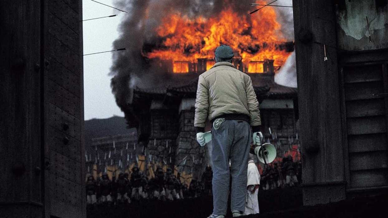 Akira Kurosawa watching an explosion on location for 'Ran'