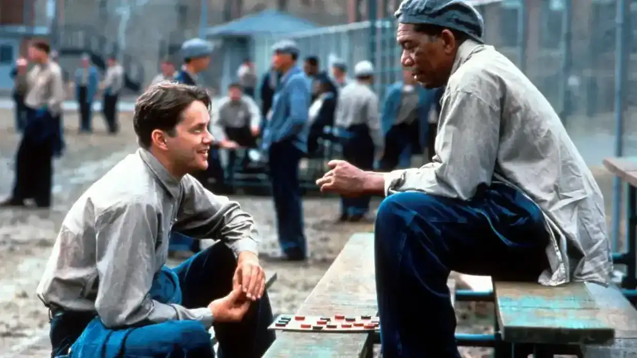 Andy Dufresne (Tim Robbins) and Ellis Boyd "Red" Redding (Morgan Freeman) playing checkers in the prison yard in the 1994 film The Shawshank Redemption.