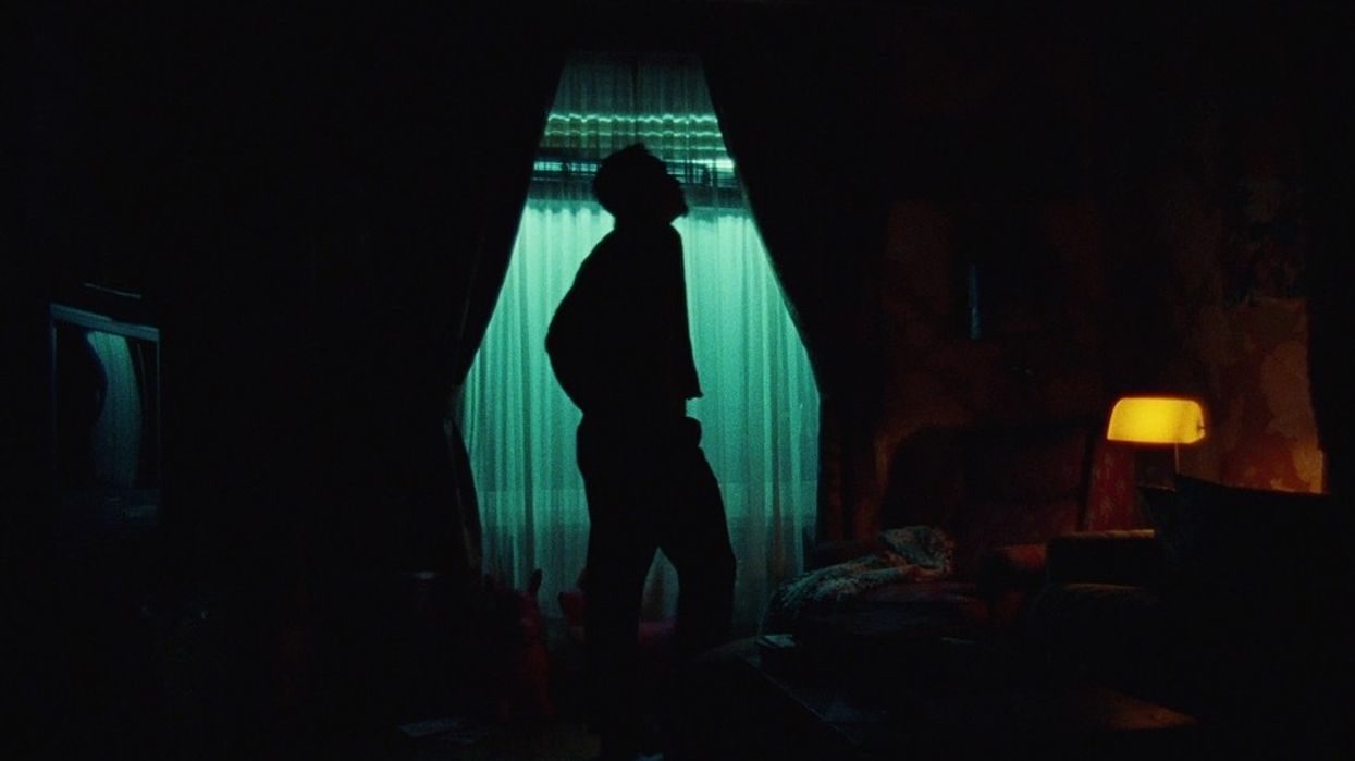 Antonio LeBlanc, played by Justin Chon, standing in a room at night in 'Blue Bayou'