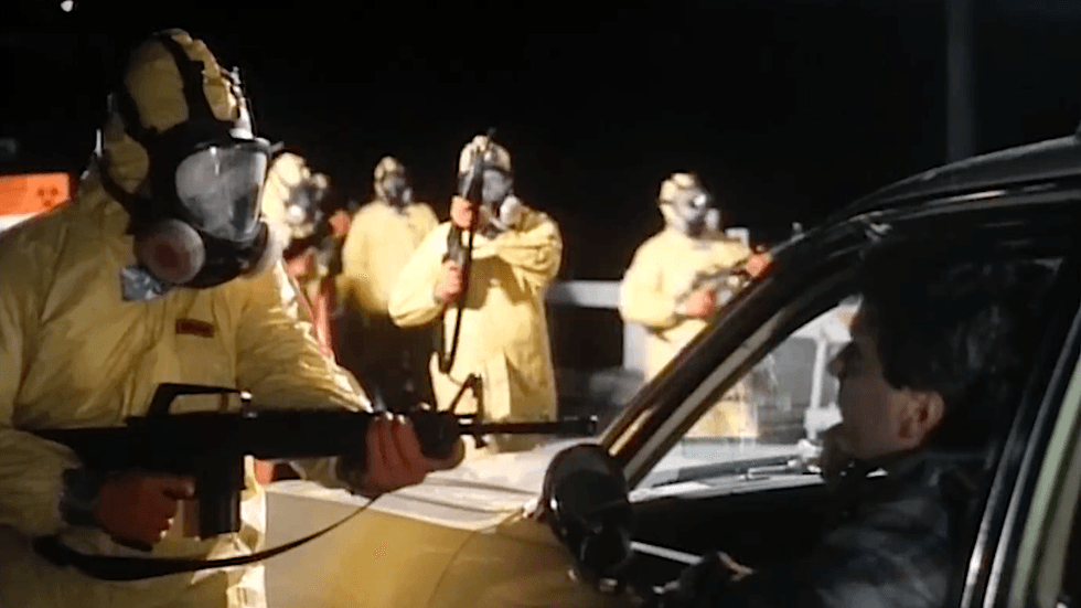 Armed operatives wearing yellow hazmat suits sealing off the area to stop the spread of a lethal dinosaur-breeding virus in \u2018Carnosaur\u2019