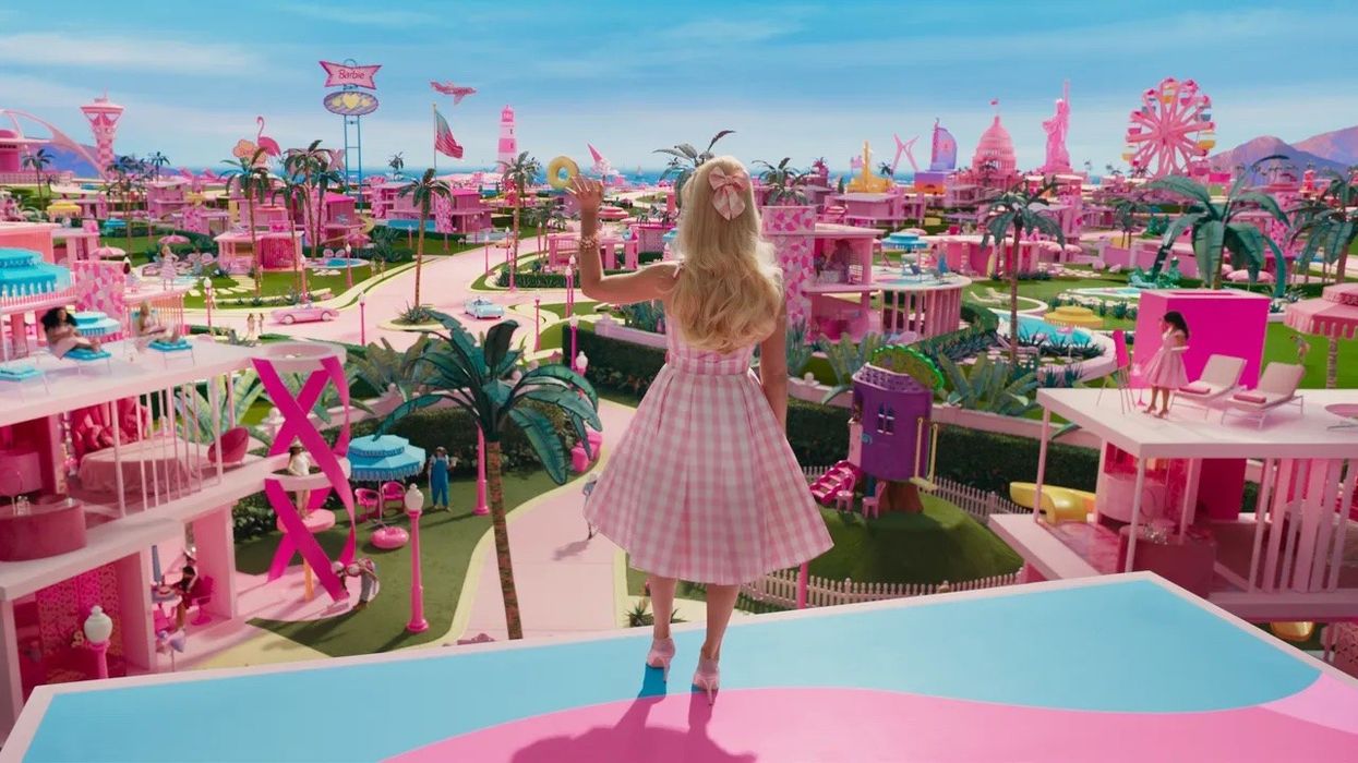 Barbie waving to everyone in the pink Barbieland, 'Barbie'