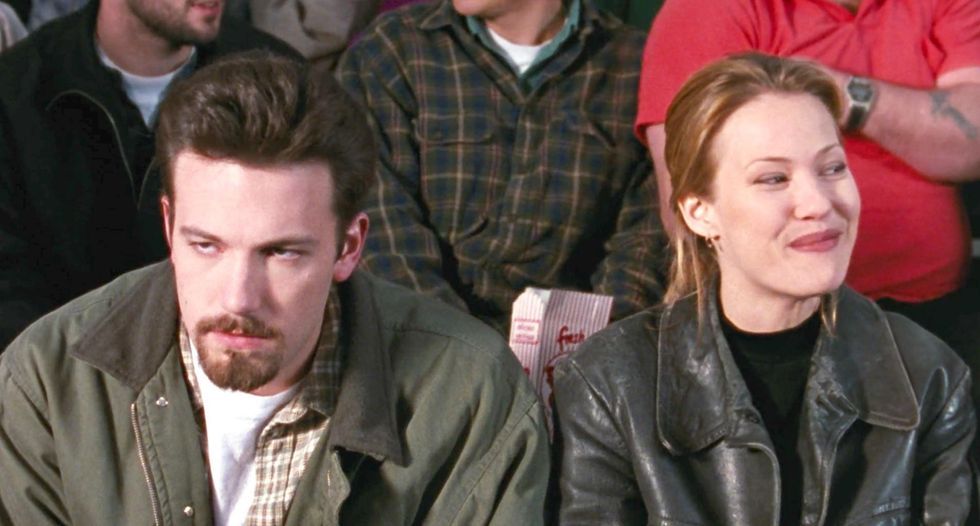Ben Affleck as Holden McNeil and Joey Lauren Adams as Alyssa Jones watching a game in 'Chasing Amy'