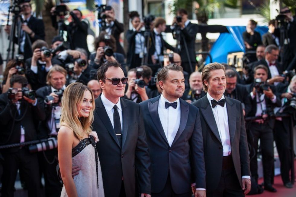 Brad Pitt, Leonardo DiCaprio, Quentin Tarantino, and Margot Robbie attend the screening of