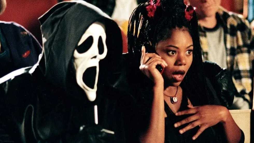 Brenda and Ghostface sitting in the movie theater in Scary Movie