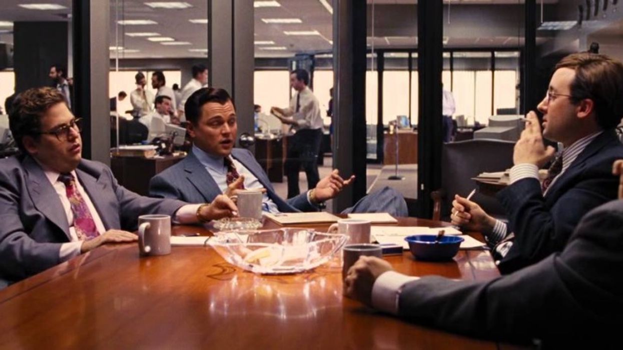 Business men in a meeting in 'The Wolf of Wall Street'