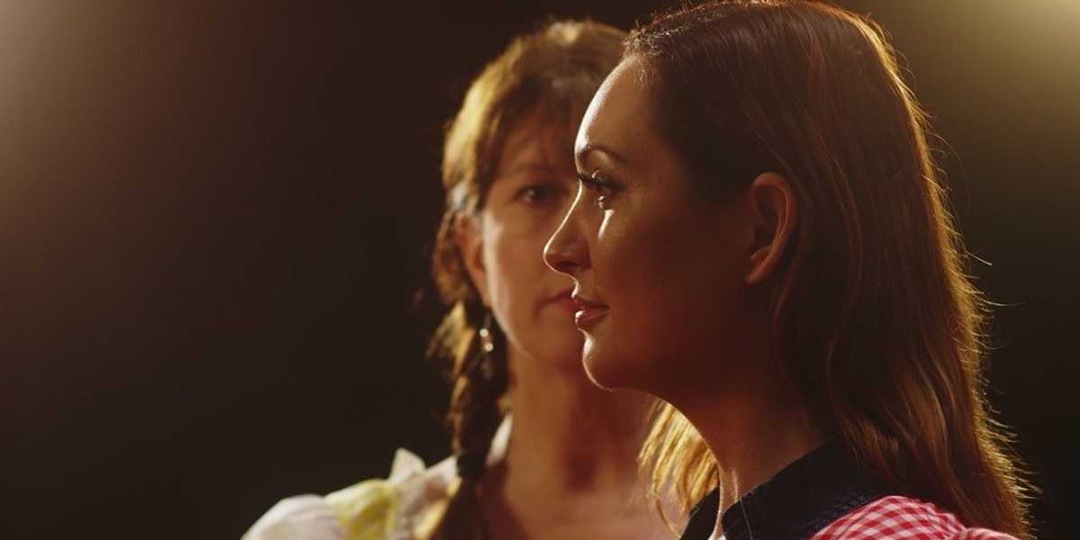 C.M. Conway and Alexandra Fabbri looking at each other in 'How to Successfully Fail in Hollywood'