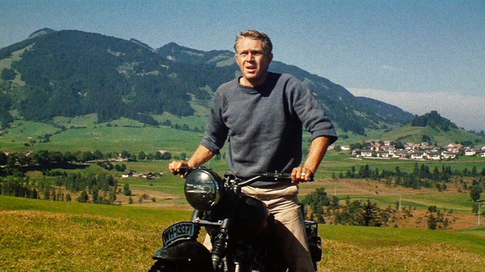 Captain Virgil Hilts, played by Steve McQueen, riding a motorcycle in 'The Great Escape'