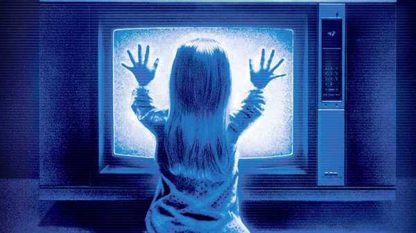 Carol Anne pressing her hands up to the TV on the poster for Poltergeist 1982