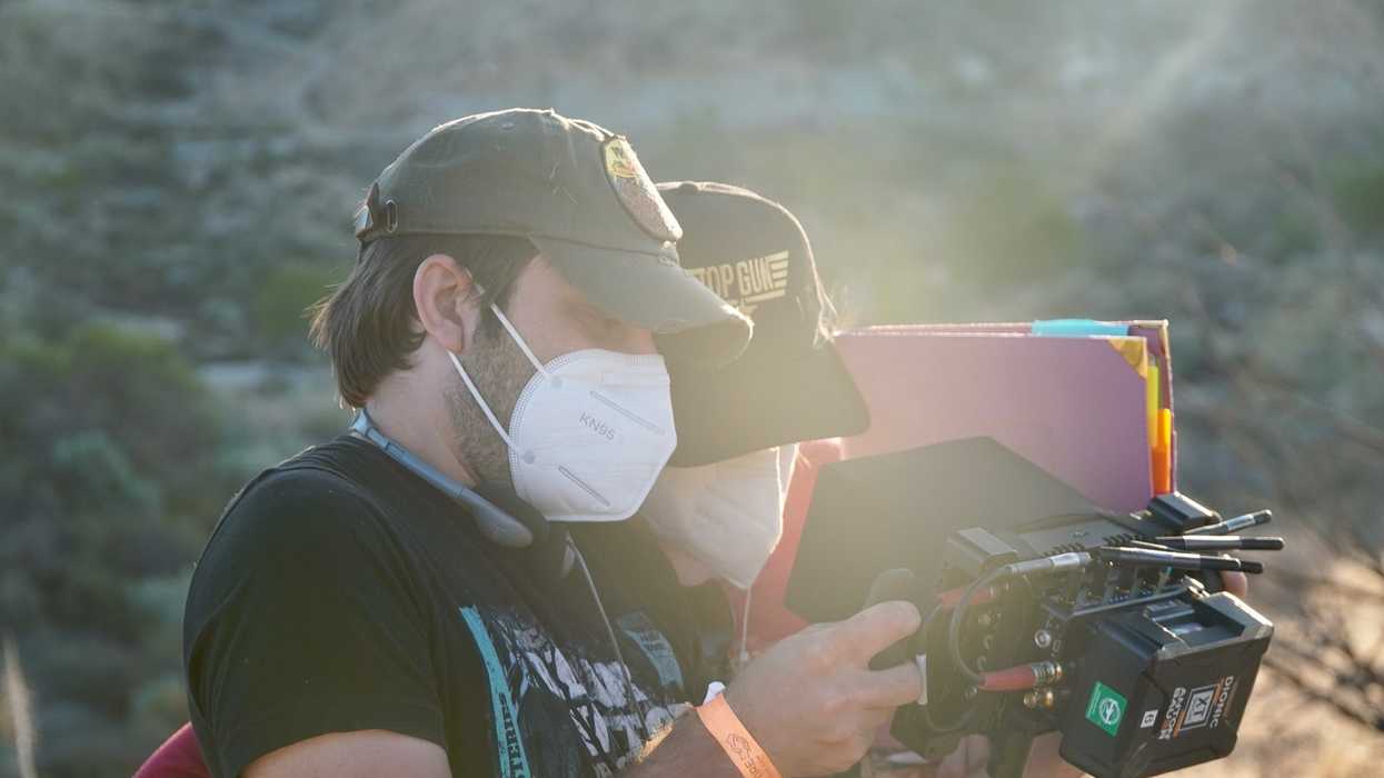 Chris and Jennifer watch a take on a portable monitor.