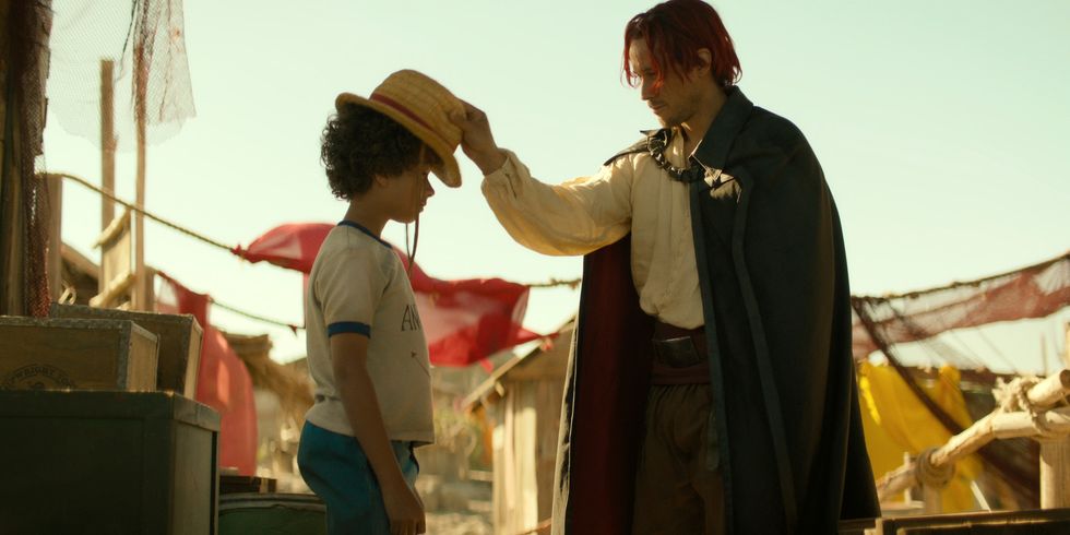 Colton Osorio as Young Luffy, Peter Gadiot as Shanks in season 1 of One Piece