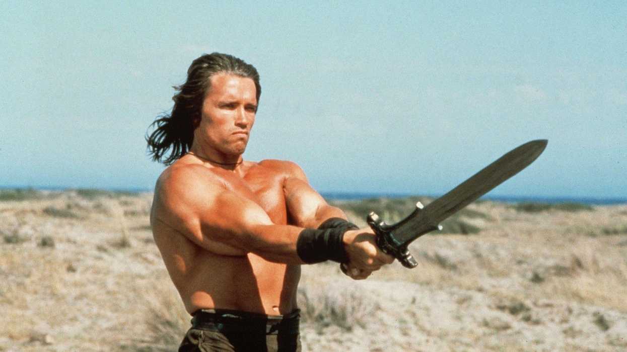Conan wielding sword outside