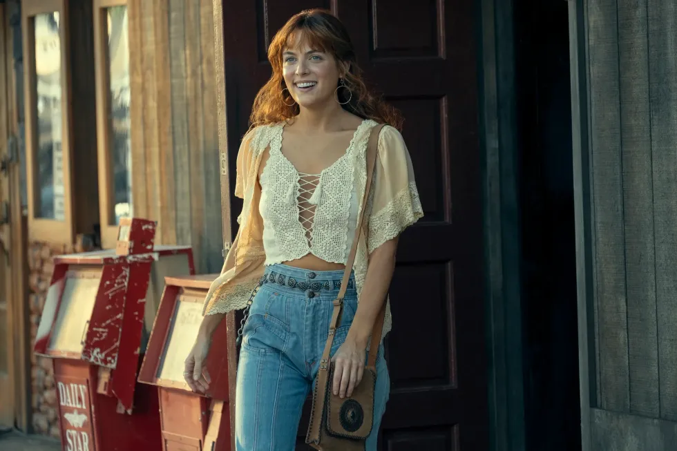 Daisy Jones, played by Riley Keough, walking in 'Daisy Jones & the Six'
