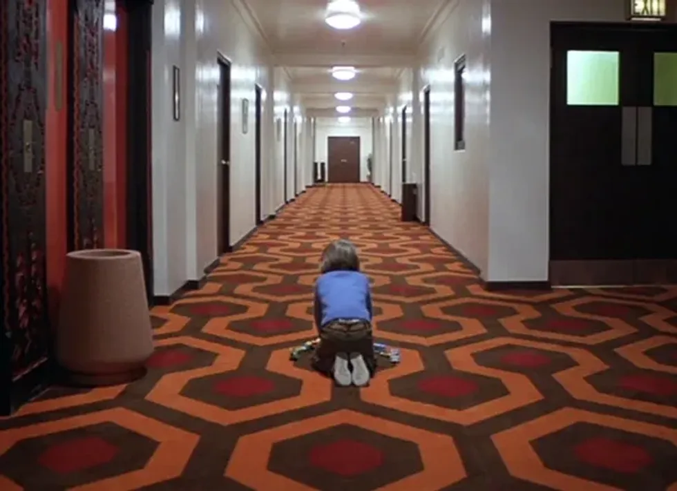 Danny, played by Danny Lloyd, playing in a hallway in 'The Shining'