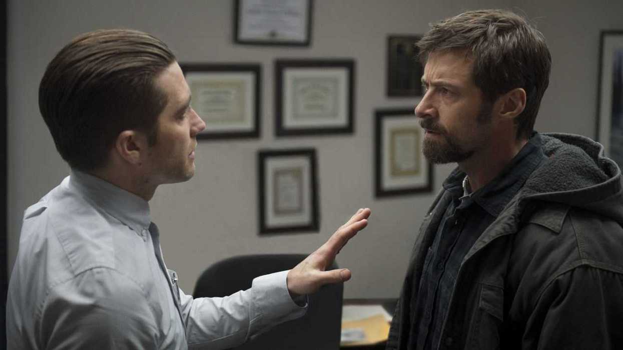Detective Loki (Jake Gyllenhaal) talking to Keller Dover (Hugh Jackman) in a tense scene from Prisoners