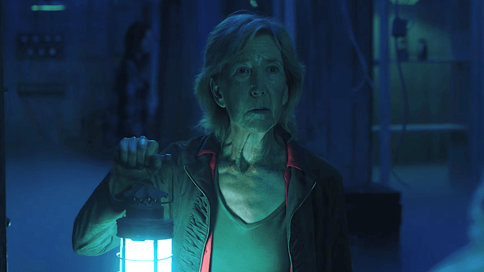 Dr. Elise Rainier holding a lantern in the horror film Insidious: The Last Key (2018)