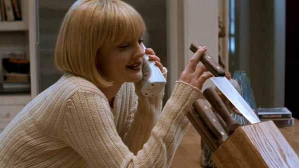 Drew Barrymore as Casey Becker toying with a knife while on the phone in Scream 1996