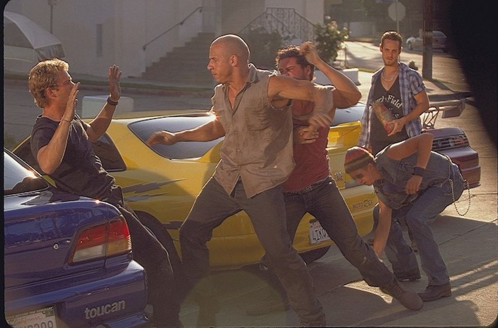 Five men fighting next to import cars, 'The Fast and the Furious'