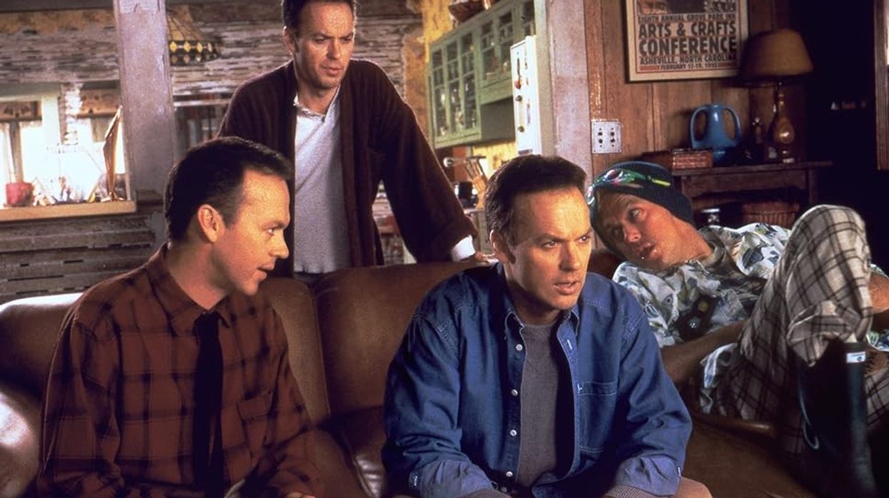 Four Doug Kinneys, played by Michael Keaton, sit on a couch together in 'Multiplicity'
