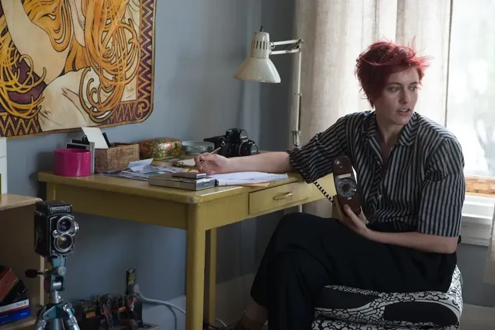 Greta Gerwig as Abbie Porter writing at a desk in '20th Century Woman'