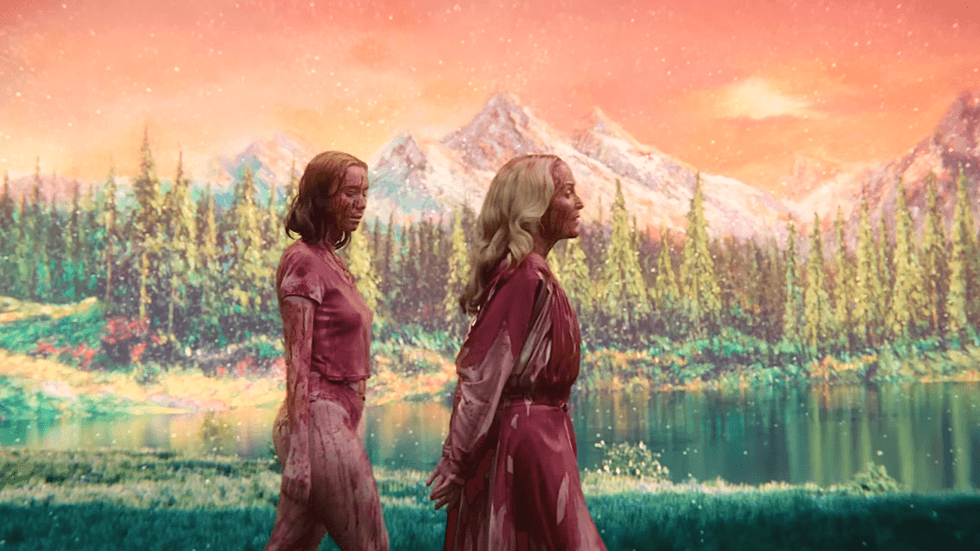 Hannah Einbinder and Gillian Anderson walking in front of a painted landscape backdrop in Teenage Sex and Death at Camp Miasma
