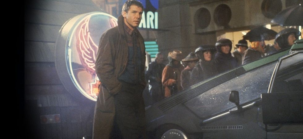 Harrison Ford as Rick Deckard standing in the rain in 'Blade Runner