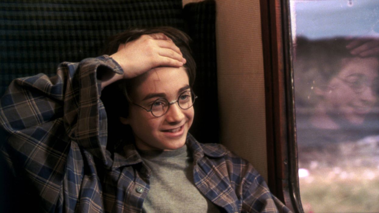 Harry Potter showing his scar on the train